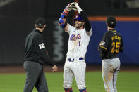 New York Mets' Jeff McNeil, center, reacts after hitting an RBI double during the seventh inning of the team's baseball game against the Pittsburgh Pirates on Tuesday, April 16, 2024, in New York. (AP Photo/Seth Wenig)