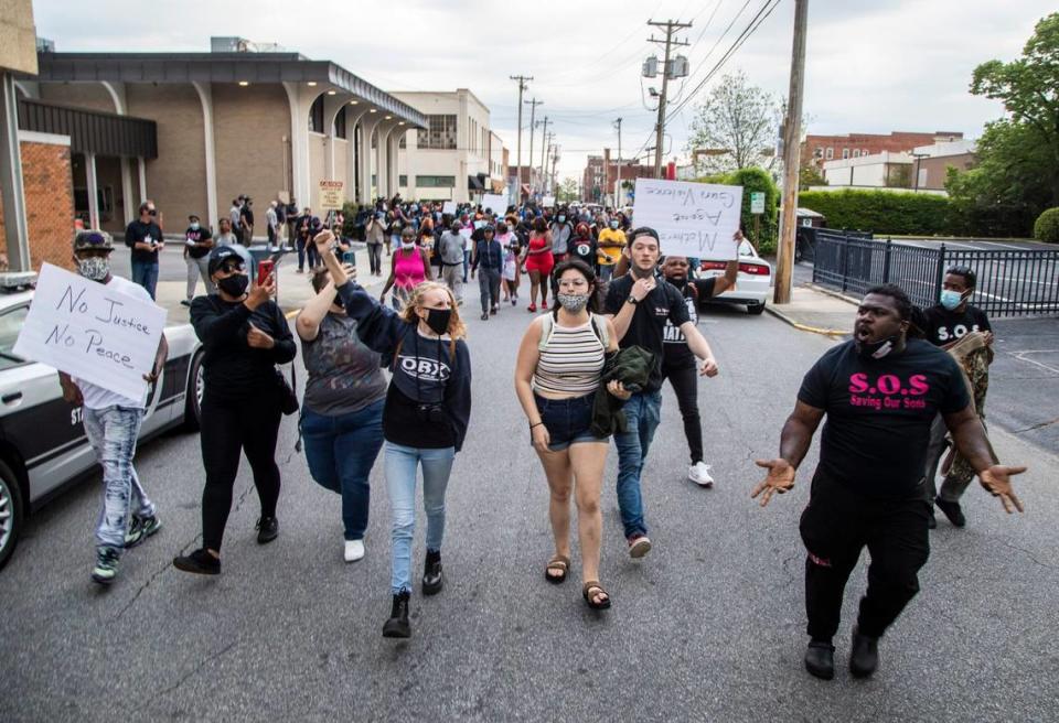 About 200 demonstrators march following an emergency city council meeting in Elizabeth City, NC Wednesday, April 21, 2022. A Pasquotank County sheriff’s deputy shot and killed Andrew Brown Jr., who is Black, on April 21, 2021 in Elizabeth City, North Carolina. Officials say they were executing a search warrant about 8:30 a.m. on Perry Street. The shooting is under review by the State Bureau of Investigation.