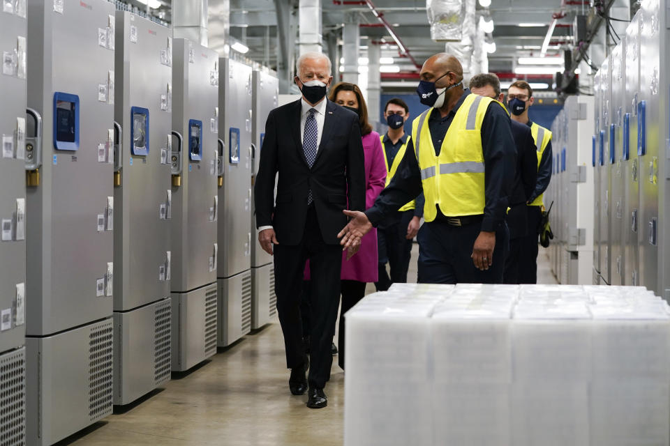 President Joe Biden tours a Pfizer manufacturing site, Friday, Feb. 19, 2021, in Portage, Mich. (AP Photo/Evan Vucci)