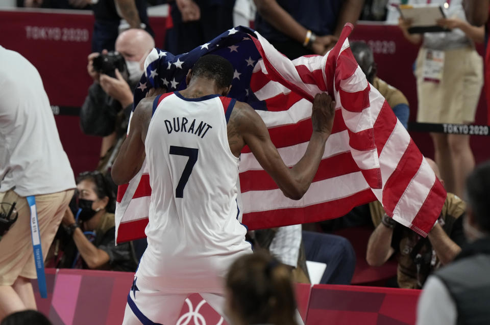 United States' Kevin Durant (7) celebrates after their win in the men's basketball gold medal game against France at the 2020 Summer Olympics, Saturday, Aug. 7, 2021, in Saitama, Japan. (AP Photo/Luca Bruno)