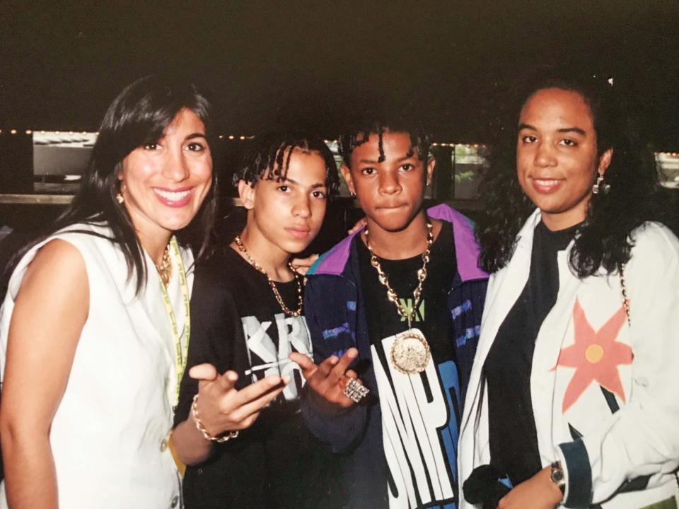 Angela Thomas and Chrissy Murry representing Columbia Records celebrates with Chris Kelly and Chris Smith of Kriss Kross’s after their album, Totally Krossed Out went platinum in 1991.