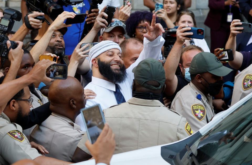 Adnan Syed walks out of Baltimore court a free man after his conviction was overturned (REUTERS)