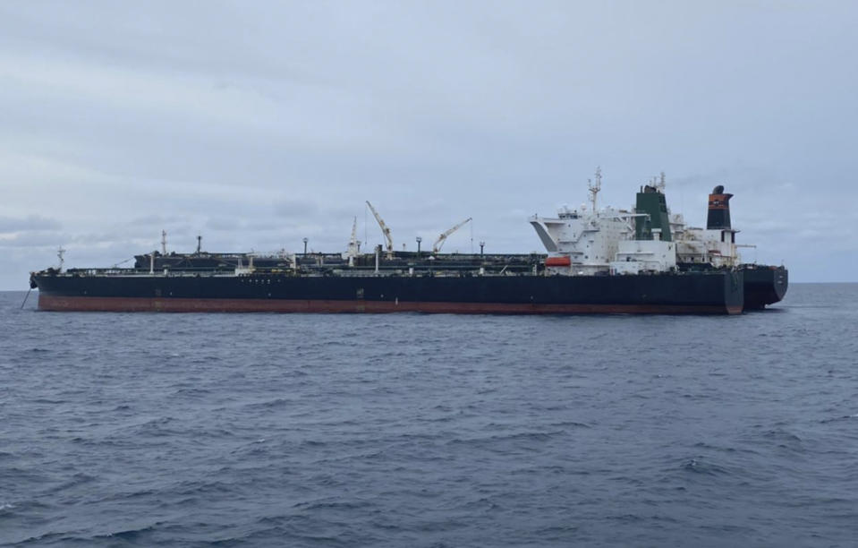 In this photo released by Indonesian Maritime Security Agency (BAKAMLA), Iranian-flagged MT Horse and Panamanian-flagged MT Frea, rear, tankers are seen anchored together in Pontianak waters off Borneo island, Indonesia, Sunday, Jan. 24, 2021. Indonesian authorities said that they seized the two vessels suspected of carrying out the illegal transfer of oil in their country's waters. (Indonesian Maritime Security Agency via AP)