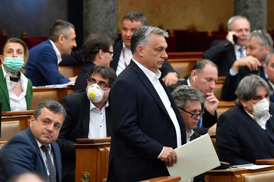 Hungarian Prime Minister Viktor Orban (standing) at the session of the Hungarian Parliament in Budapest on Monday where his government gained sweeping powers amid the coronavirus crisis. Critics express deep concerns about how he will wield his new authority. (Photo: ZOLTAN MATHE via Getty Images)