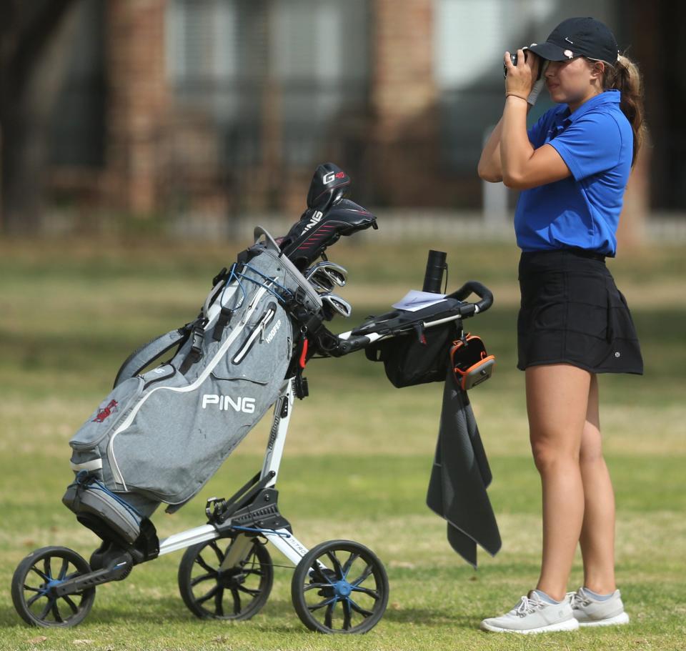 San Angelo Central High School's Savannah Beaty checks out the distance to the green during the final round of the District 2-6A Girls Golf Tournament at Bentwood Country Club on Tuesday, March 29, 2022.