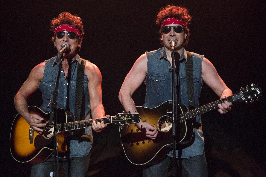 This image released by NBC shows Bruce Springsteen, left, and Jimmy Fallon performing during "Late Night with Jimmy Fallon," on Tuesday, Jan. 14, 2014, in New York. (AP Photo/NBC, Lloyd Bishop)