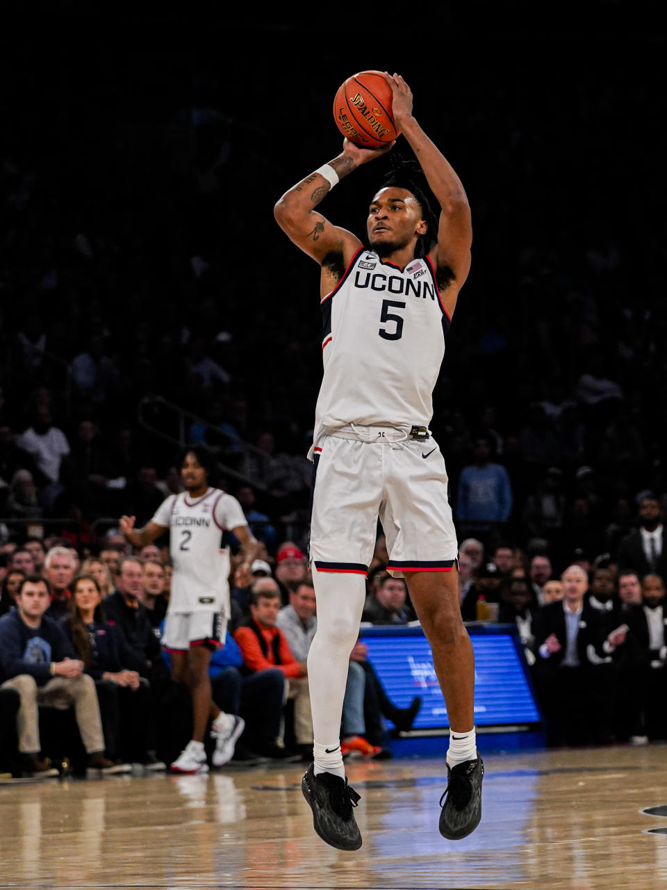 UConn guard Stephon Castle (5) shoots the ball during the first half of an NCAA college basketball game against North Carolina in New York, Tuesday, Dec. 5, 2023. (AP Photo/Peter K. Afriyie)