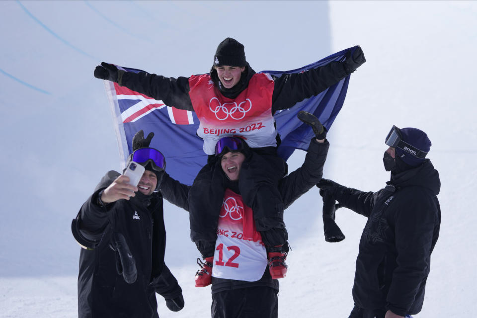 Gold medal winner New Zealand's Nico Porteous celebrates after the venue award ceremony for the men's halfpipe at the 2022 Winter Olympics, Saturday, Feb. 19, 2022, in Zhangjiakou, China. (AP Photo/Lee Jin-man)