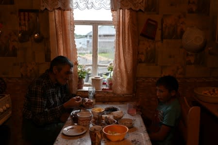 The Wider Image: Russian village's last teacher stays on for her one remaining pupil