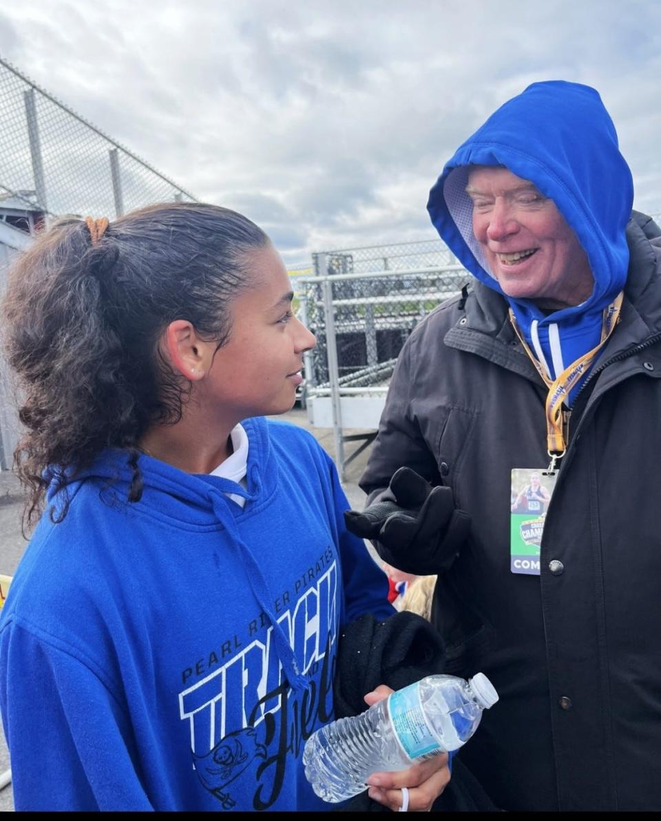 Pearl River senior Mady Moroney talks with coach Dan Doherty after she medaled Nov. 11, 2023 at the state cross-country championships in Verona, New York. Moroney ran for Doherty since she was in eighth grade.