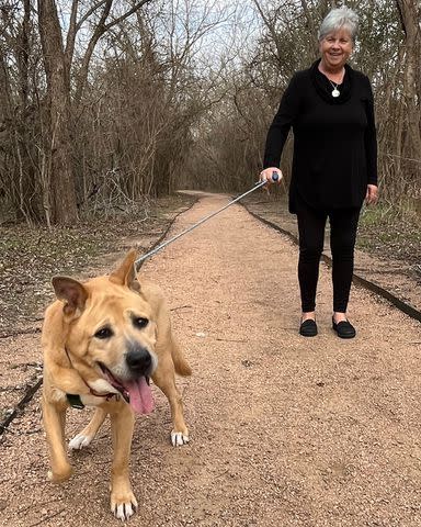 <p>Karen Hardwick/Austin Pets Alive!</p> Velcro the senior rescue dog with his new owner, Jeanette