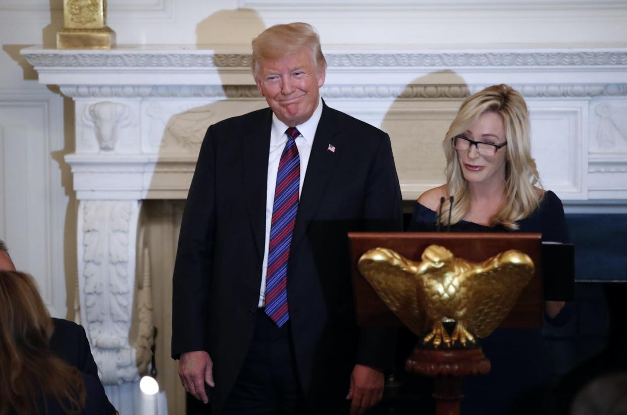 <span class="caption">President Donald Trump with pastor Paula White during a dinner for evangelical leaders in the White House, on Aug. 27, 2018.</span> <span class="attribution"><span class="source">AP Photo/Alex Brandon</span></span>