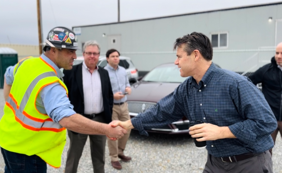 U.S. Sen. Todd Young shakes hands with a construction worker at the Liberation Labs construction site in Richmond as part of his "Made in Indiana" tour, Monday, March 4, 2024.