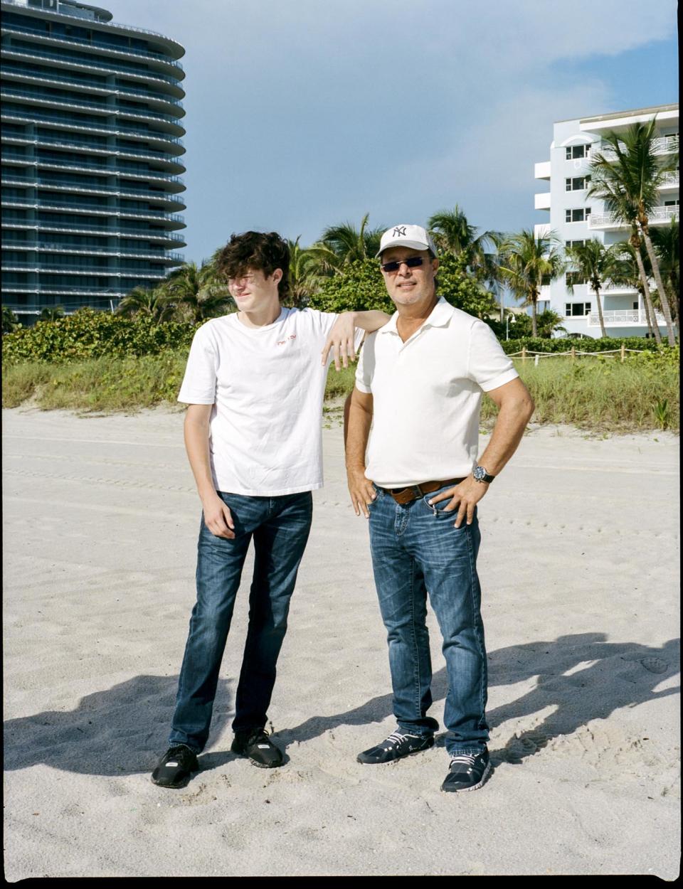 Jonah and his father, Neil, on Surfside Beach in June. - Credit: Ysa Pérez for Rolling Stone