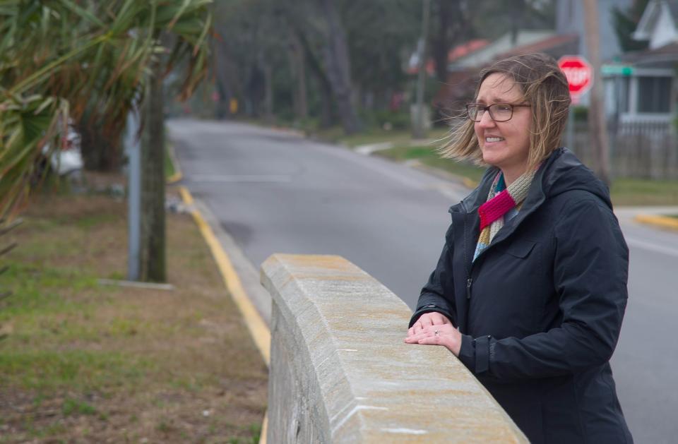 Jessica Beach stands on a bridge on South Street where Lake Maria Sanchez flows into the Matanzas River in February 2018. The city of St. Augustine chose Beach as its chief resilience officer, a role that includes reducing flooding in the city ― a project at Lake Maria Sanchez is part of those efforts.