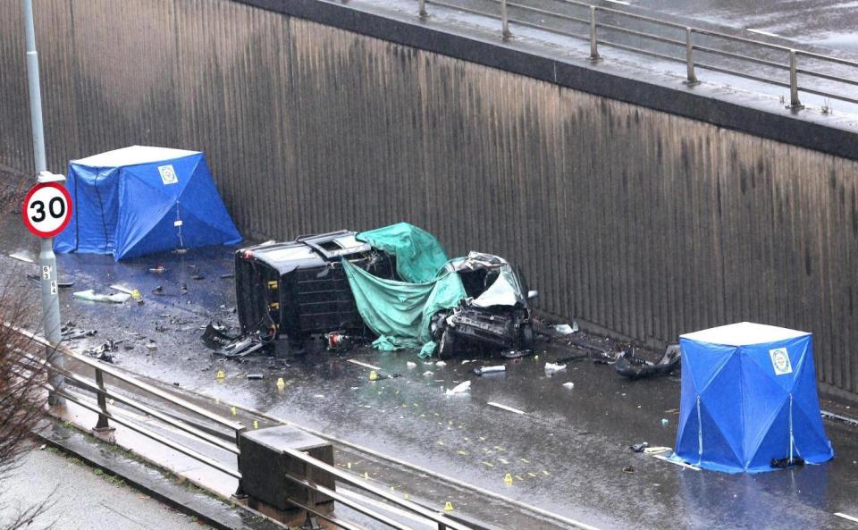 A black taxi is left on its side following the crash on Lee Bank Middleway, which killed its driver and two passengers (PA)