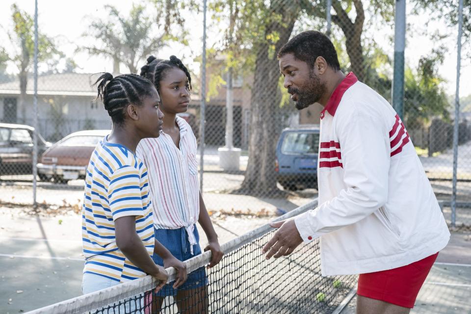 L–R: Demi Singleton, as Serena Williams, Saniyya Sidney, as Venus Williams, and Will Smith, as Richard Williams in King Richard. - Credit: Chiabella James/© Warner Bros./Courtesy Everett Collection