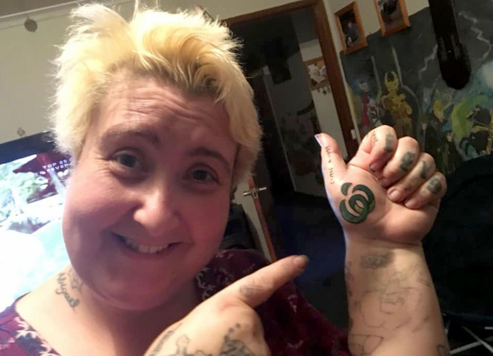 Hobart mum Elisabete Lincoln, 43, decided to have the Woolworths logo tattooed on her hand. Source: Caters