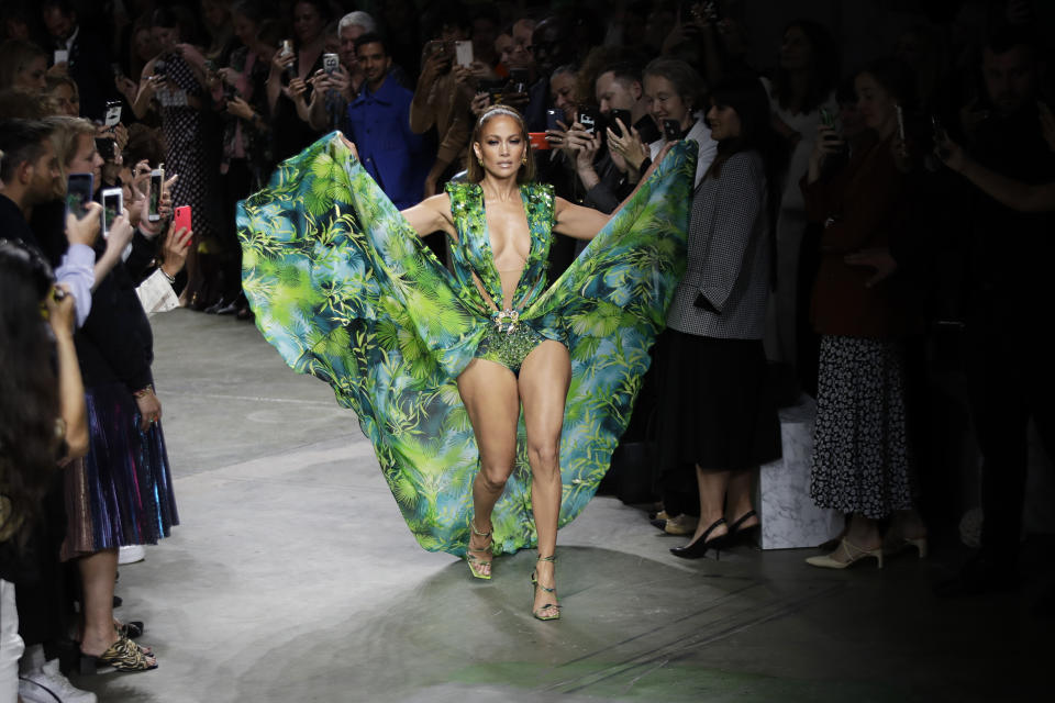 Jennifer Lopez wears a creation as part of the Versace Spring-Summer 2020 collection, unveiled during the fashion week, in Milan, Italy, on Sept. 20, 2019. (AP Photo/Luca Bruno)