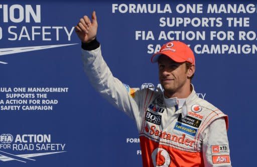 McLaren Mercedes driver Jenson Button celebrates in the parc ferme after the qualifing session at the Spa-Francorchamps circuit in Spa. Button took his first pole position for McLaren when he clocked the fastest time during qualifying for Sunday's Belgian Grand Prix