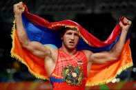 <p>Artur Aleksanyan of Armenia celebrates after defeating Yasmany Daniel Lugo Cabrera of Cuba in the Men’s Greco-Roman 98 kg Gold Medal final bout on Day 11 of the Rio 2016 Olympic Games at Carioca Arena 2 on August 16, 2016 in Rio de Janeiro, Brazil. (Photo by Sean M. Haffey/Getty Images) </p>