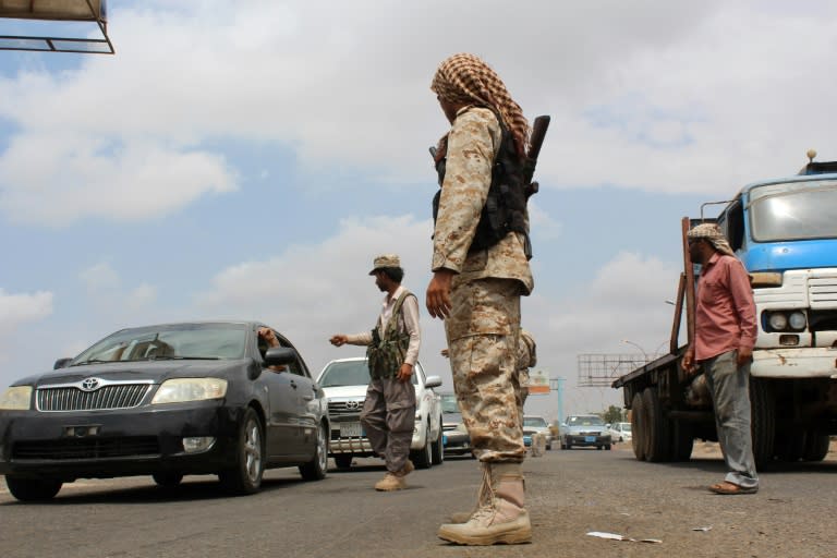 Yemeni loyalist forces man a checkpoint on a road in Aden on April 9, 2016