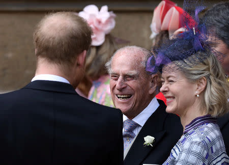 Britain's Prince Philip, Duke of Edinburgh talks to Prince Harry as they leave after the wedding of Lady Gabriella Windsor and Thomas Kingston at St George's Chapel, in Windsor Castle, near London, Britain May 18, 2019. Steve Parsons/Pool via REUTERS