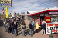 A crowd of people line up outside the Arizona Last Stop convenience store and souvenir shop to buy Powerball tickets, Tuesday, Nov. 27, 2012, in White Hills, Ariz. There has been no Powerball winner since Oct. 6, and the jackpot already has reached a record level for the game. Already over $500 million, it is the second-highest jackpot in lottery history, behind only the $656 million Mega Millions prize in March. (AP Photo/Julie Jacobson)