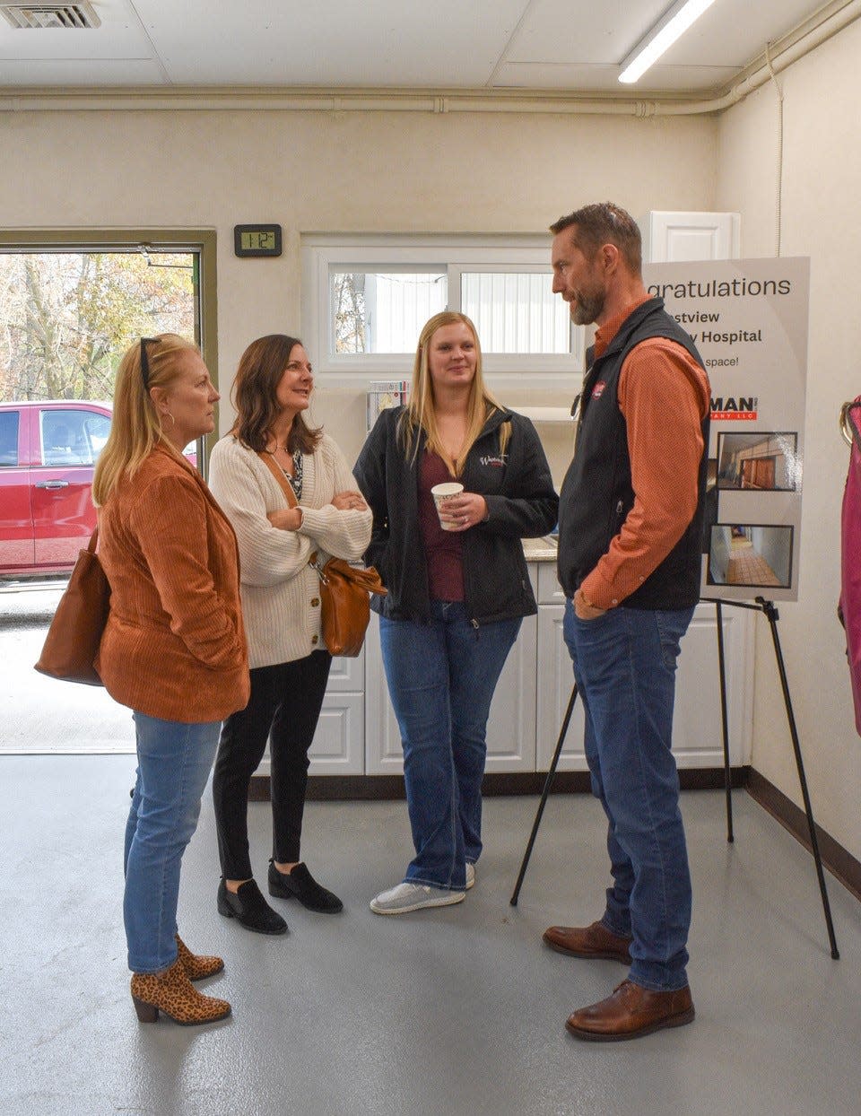 Dr. Ryan Zimmerman, right, talks to guests during the Westview Veterinary Hospital open house on Nov. 5. The event highlighted the new surgery addition and renovated equine building.