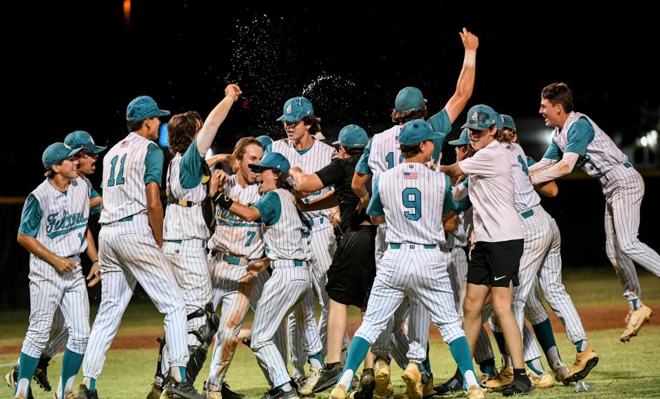 Jensen Beach players celebrate their victory over Merritt Island in the finals of the District 12-4A baseball tournament. Craig Bailey/FLORIDA TODAY via USA TODAY NETWORK