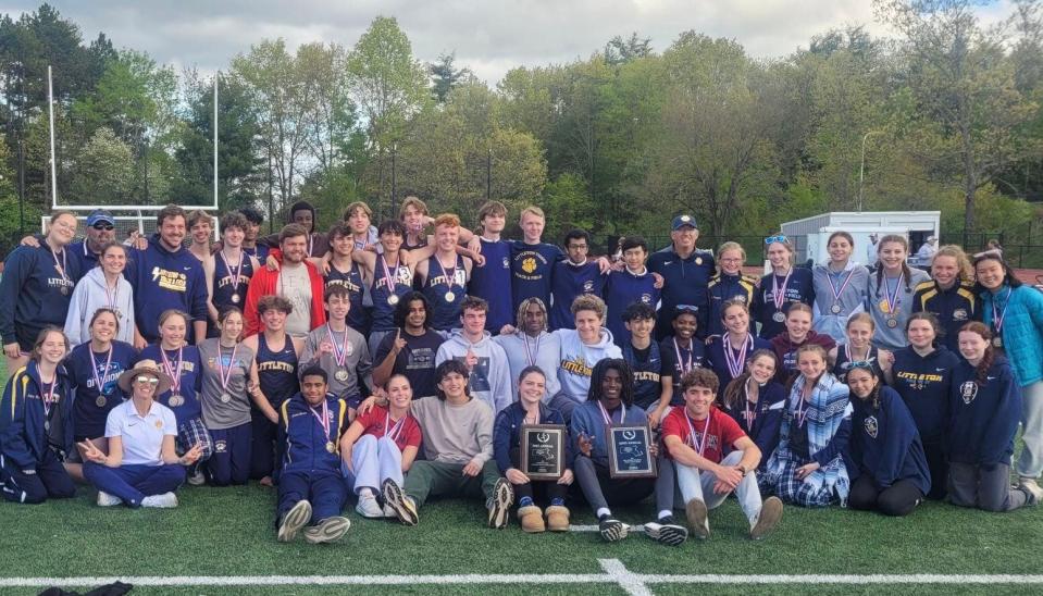 Littleton track and field athletes and coaches pose together as the Tigers celebrate winning the boys' and girls' Division 2 District E championships on Saturday at Ayer-Shirley High School.