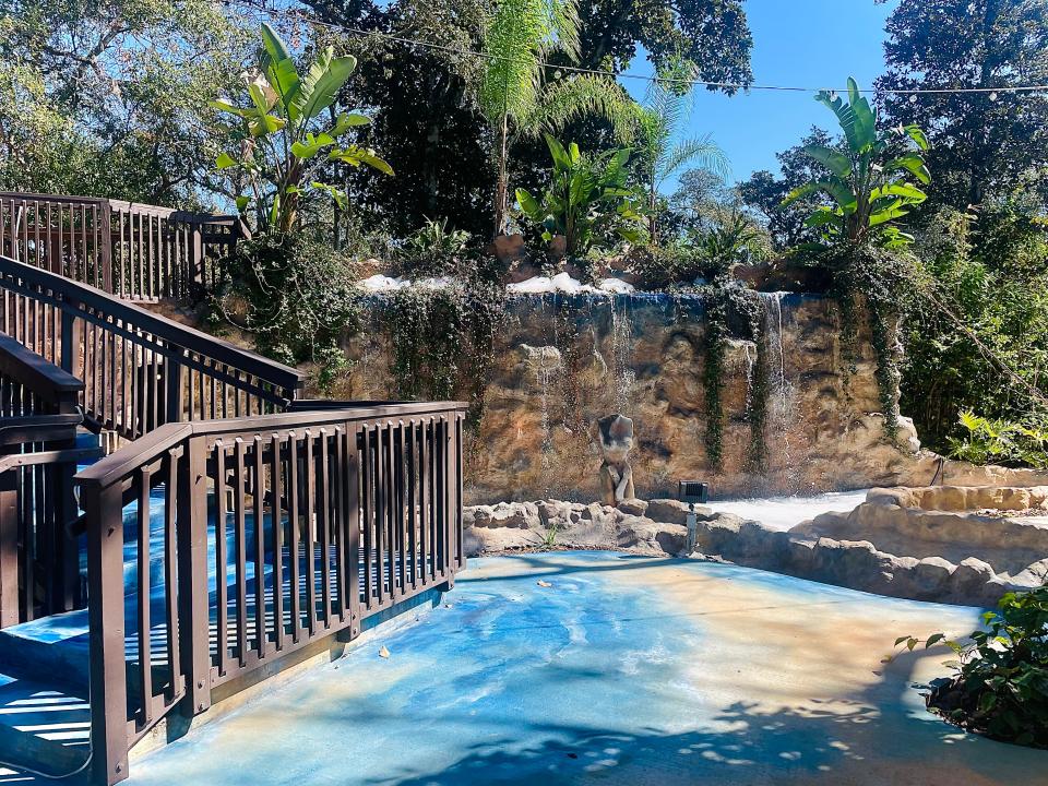 A look into the outdoor space at The Shape of Water Restaurant, featuring the garden's longest waterfall, water-painted walkway and pathway to the eatery's elevated lounge area.