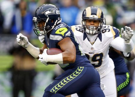 FILE PHOTO: Dec 27, 2015; Seattle, WA, USA; Seattle Seahawks running back Fred Jackson (22) is tackled by St. Louis Rams defensive tackle Aaron Donald (99) during the first quarter at CenturyLink Field. Mandatory Credit: Joe Nicholson-USA TODAY Sports