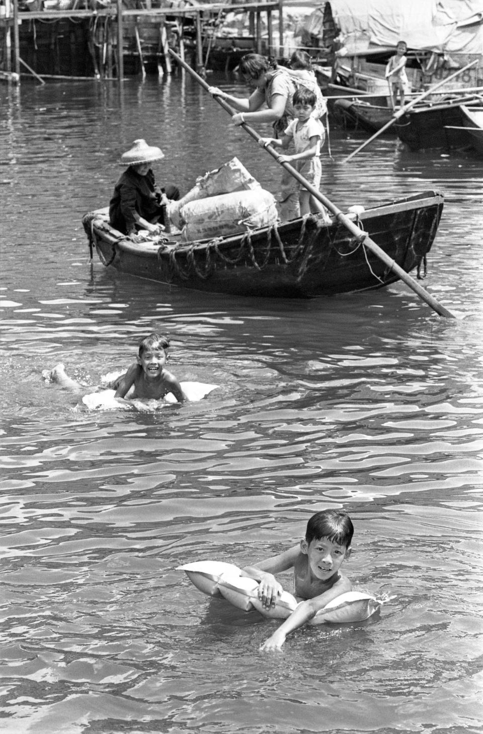 Children going for a swim in Aberdeen Harbor.