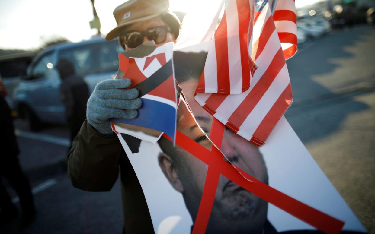 Protesters in South Korea have been demonstrating ahead of the arrival of the North's Winter Olympics teams - REUTERS