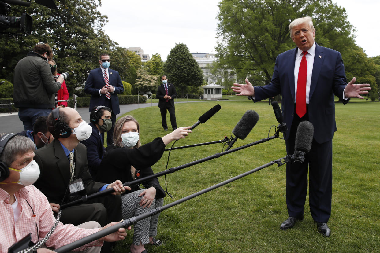 President Donald Trump speaks with reporters on the South Lawn of the White House as he departs on Marine One, Thursday, May 14, 2020, in Washington. Trump is en route to Allentown, Pa. (AP Photo/Alex Brandon)