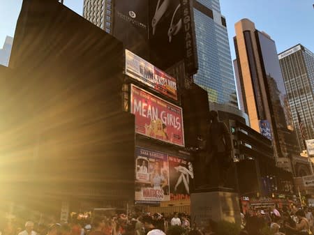 A blackout during widespread power outages affects some buildings in Times Square, in the Manhattan borough of New York, U.S, in this image obtained via social media