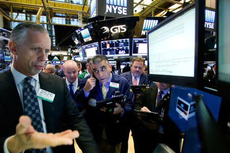 Traders work on the floor of the New York Stock Exchange (NYSE) in New York City, U.S., November 10, 2016. REUTERS/Brendan McDermid