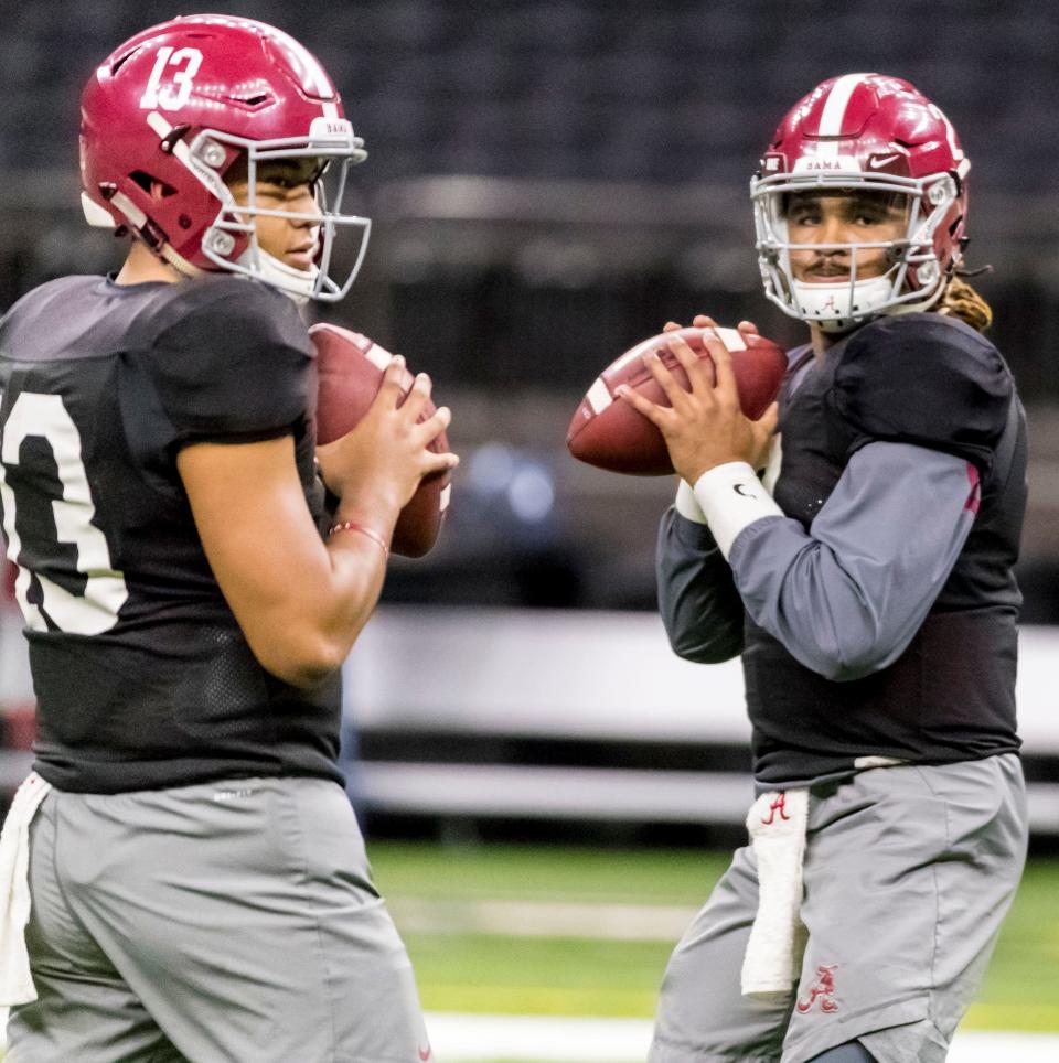 Alabama quarterbacks Tua Tagovailoa (13) and Jalen Hurts (2) drill together at NCAA college football practice for the Sugar Bowl against Clemson, Thursday, Dec. 28, 2017, in New Orleans, La. (Vasha Hunt/AL.com via AP)