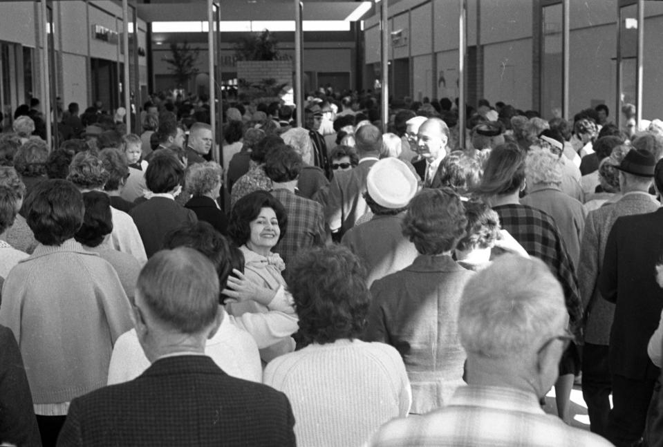 March 2, 1967: Thousands of visitors charge through the entrance at Regency Square Mall during the opening hours of its grand opening day.