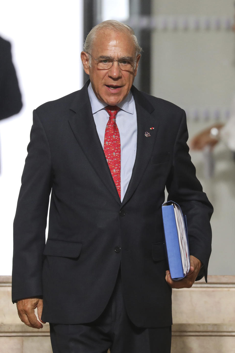 The Organization for Economic Co-operation and Development (OECD) Secretary General Jose Angel Gurria arrives in Biarritz, southwestern France, Sunday Aug. 25, 2019. Fissures emerged among G-7 leaders on Sunday over how to deal with the threat of a global recession, China and Iran, casting deep uncertainty over this year's summit of the world's major democracies as U.S. President Donald Trump appeared increasingly isolated among a gathering of the country's closest allies. (Ludovic Marin/Pool via AP)