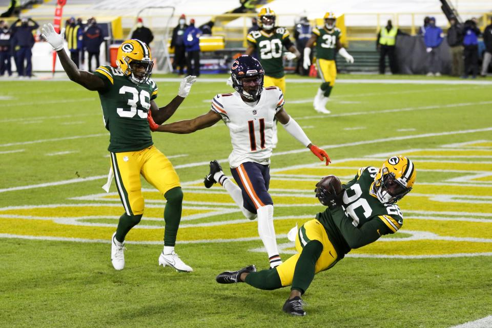 Green Bay Packers' Darnell Savage intercepts a pass in the end zone in front of Chicago Bears' Darnell Mooney during the first half of an NFL football game Sunday, Nov. 29, 2020, in Green Bay, Wis. (AP Photo/Matt Ludtke)