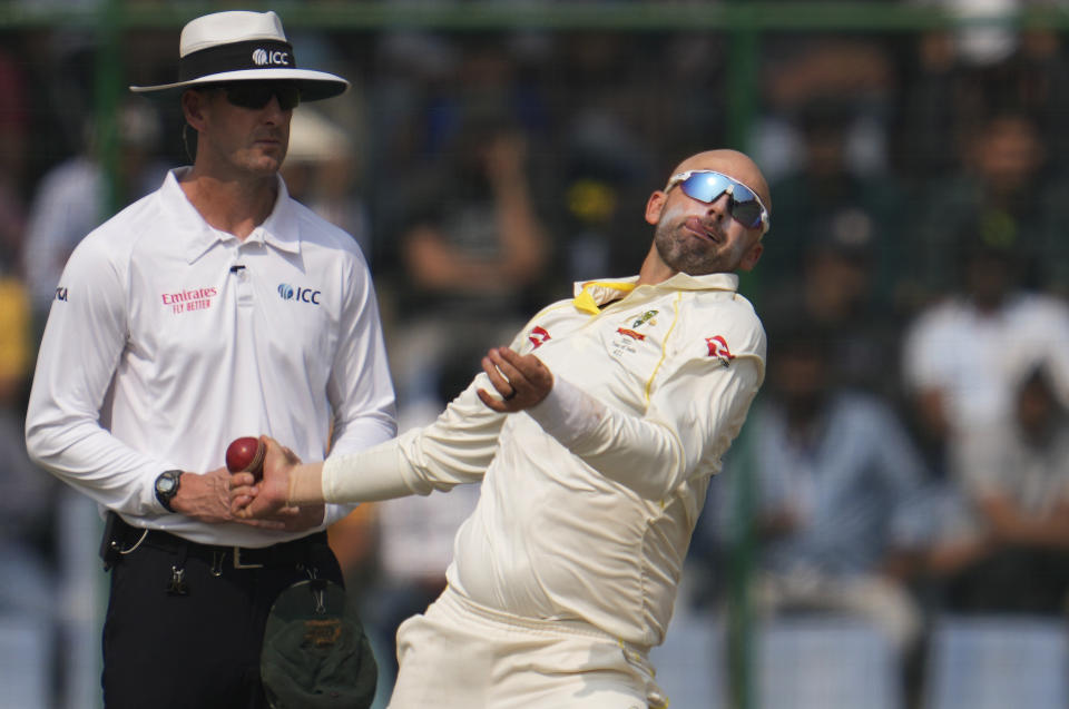Australia's Nathan Lyon bowls during the second day of the second cricket test match between India and Australia in New Delhi, India, Saturday, Feb.18, 2023. (AP Photo/Altaf Qadri)