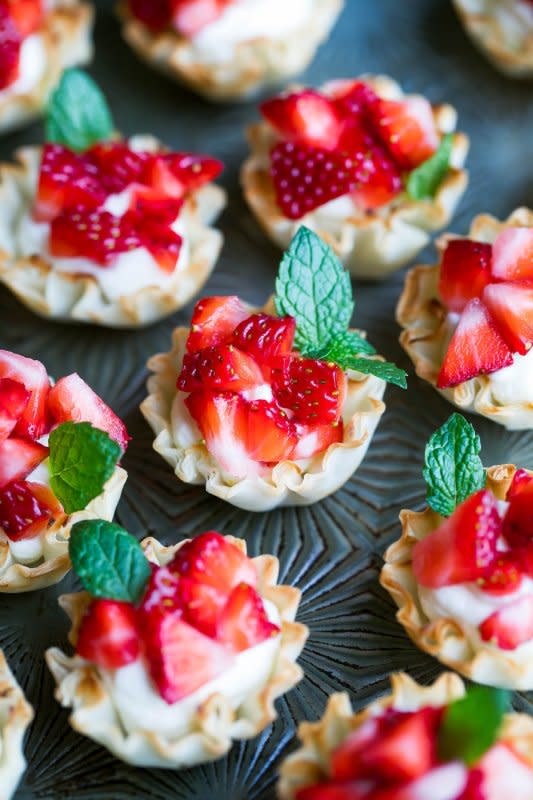 <p>Peas and Crayons</p><p>Ready in just 15 minutes, these no-bake whipped feta strawberry phyllo cups are a perfect dessert for parties, showers and gatherings galore!</p><p><strong>Get the recipe: <a href="https://peasandcrayons.com/2018/05/strawberry-phyllo-cups.html" rel="nofollow noopener" target="_blank" data-ylk="slk:Strawberry Phyllo Cups;elm:context_link;itc:0;sec:content-canvas" class="link "><em>Strawberry Phyllo Cups</em></a></strong></p>