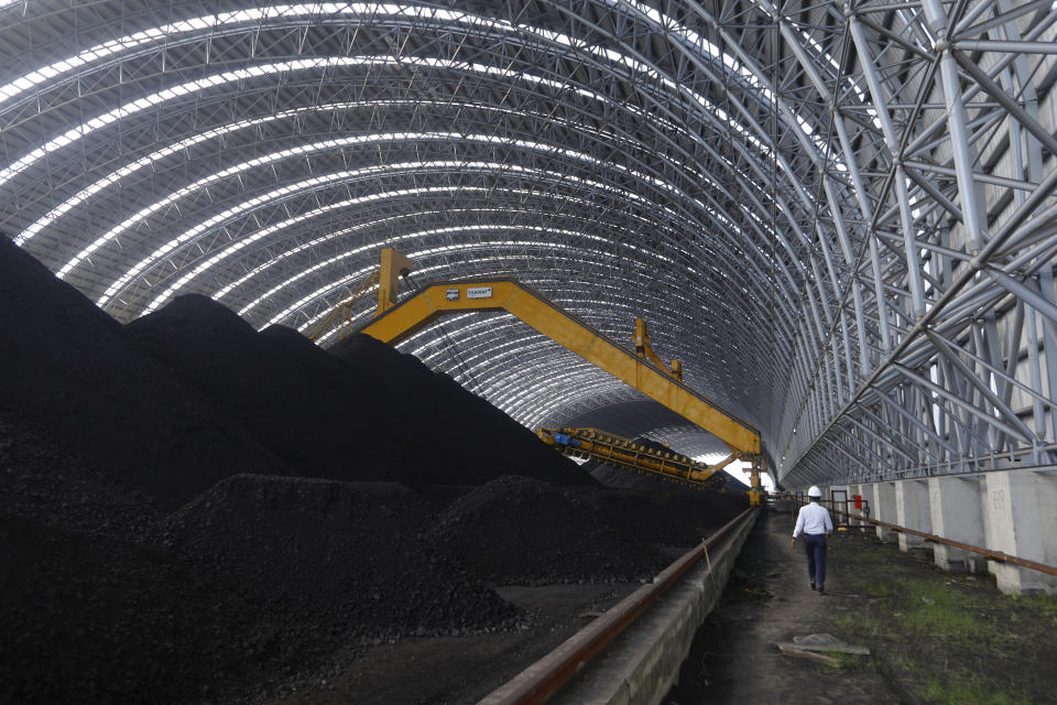 Coal is being stored for the Maitree Super Thermal Power Project near the Sundarbans, the world’s largest mangrove forest, in Rampal, Bangladesh, Monday, Oct. 17, 2022. A power plant will start burning coal as part of Bangladesh’s plan to meet its energy needs and improve living standards, officials say. (AP Photo/Al-emrun Garjon)