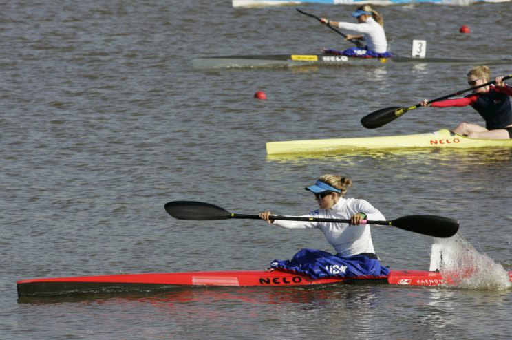 USA's Carrie Johnson, front, drives to the finish ahead of USA's Kari-Jean McKenzie, center, and USA's Maggie Hogan, top, in a heat of the women's 200m kayak in the Oklahoma Centennial Regatta Festival, in Oklahoma City, Sunday, Oct. 14, 2007. (AP Photo)