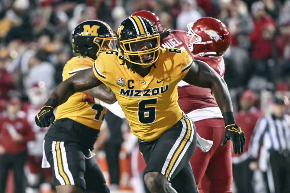 FILE - Missouri defensive lineman Darius Robinson (6) plays against Arkansas during an NCAA college football game Nov. 24, 2023, in Fayetteville, Ark. The Arizona Cardinals selected Robinson in the NFL draft Thursday, April 25. (AP Photo/Michael Woods, FIle)