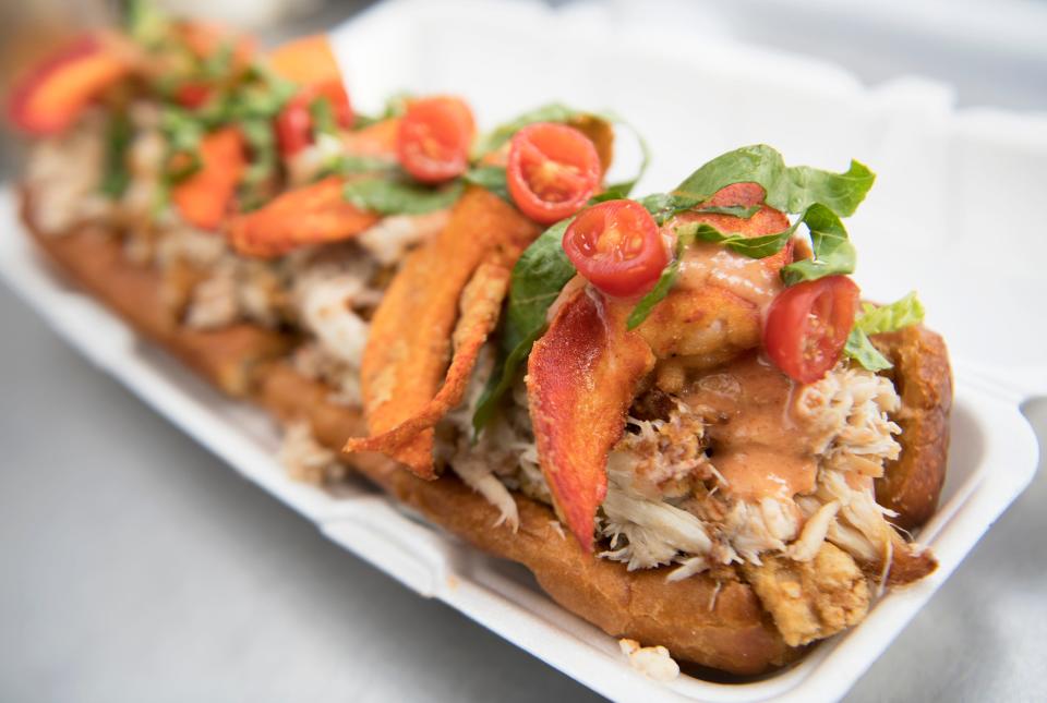 A freshly made Zochness Monster of the Zea, which is a xtra-large deep-fried hoagie roll filled with fish, shrimp, crab, and lobster, is displayed in the Zoagies food truck in Pennsville in this Courier Post file photo.