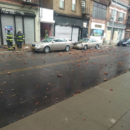 Firefighters are seen after the collapse of a building in Poughkeepsie, New York, U.S., June 18 2018, in this picture obtained from social media. Instagram/@slimty86/Tyrone Howell via REUTERS