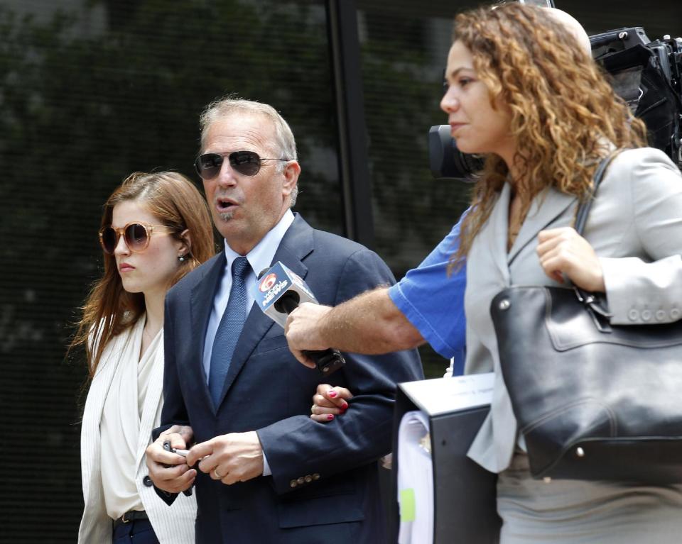 Actor Kevin Costner, center, leaves Federal Court for a lunch break in New Orleans, Monday, June 4, 2012. Stephen Baldwin has sued fellow actor Costner over their investments in a device that BP used in trying to clean up the massive Gulf of Mexico oil spill. The federal lawsuit filed in New Orleans on Wednesday by Baldwin and a friend claims Costner and a business partner duped them out of their shares of an $18 million deal for BP to purchase oil-separating centrifuges from a company they formed after the April 20 spill. ( AP Photo/Bill Haber)